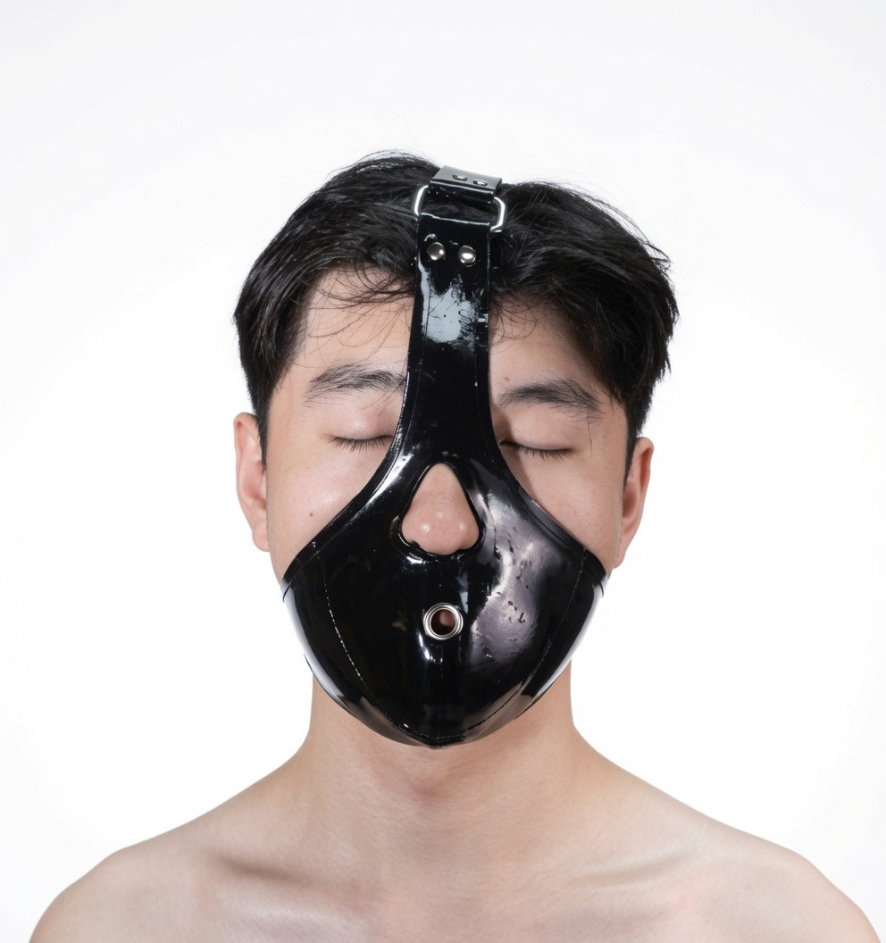 Close-up of the Leather Ball Gag Harness® showing secure locking mechanism