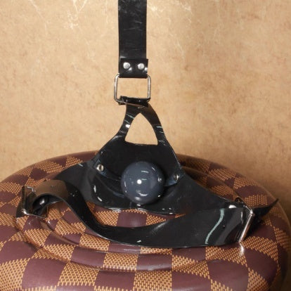 Close-up of the Leather Ball Gag Harness® showing secure locking mechanism